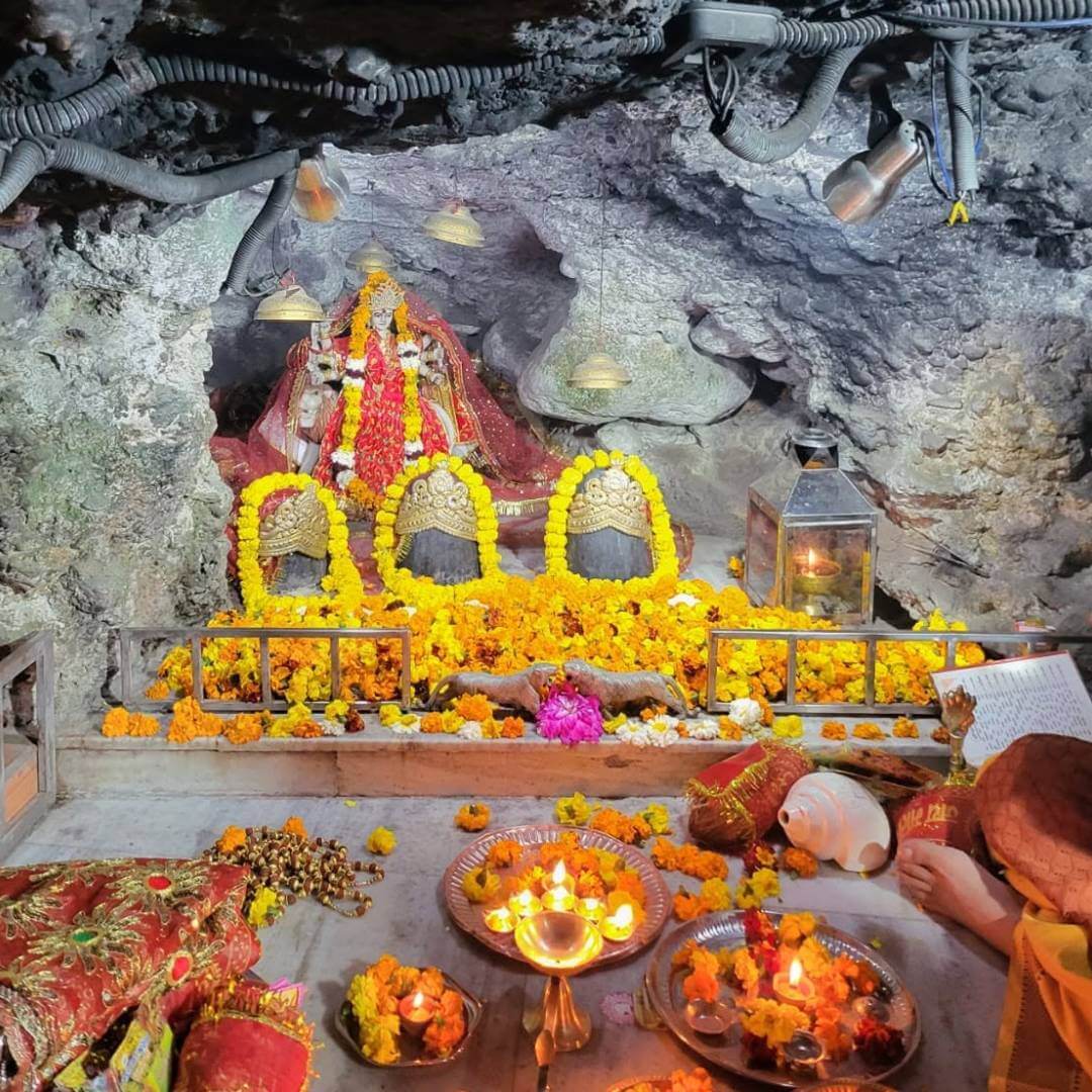 Evening aarti lamps glowing at the temple
