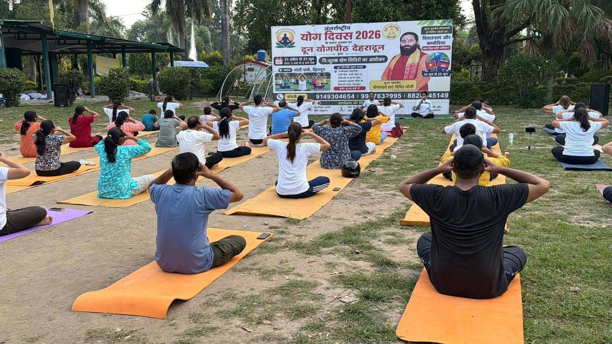 Devotees practising sunrise yoga on the temple terrace